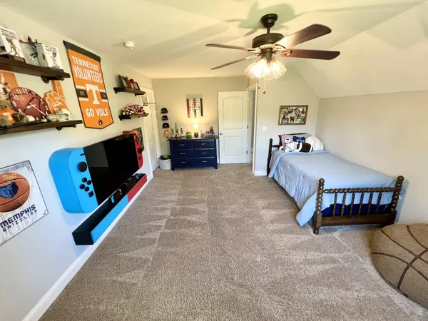 a bedroom with furniture and a bed