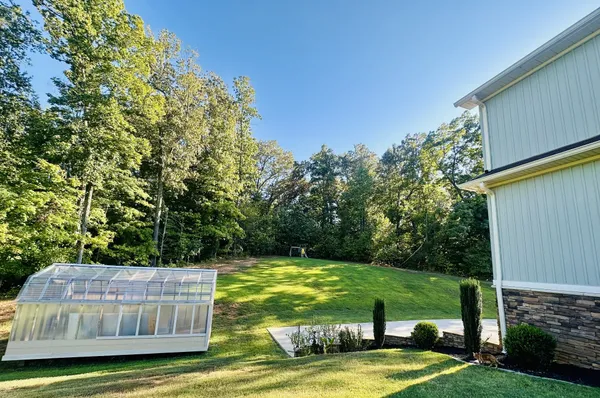 a view of a swimming pool with a garden
