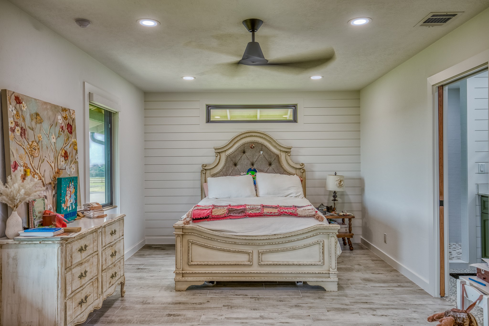 18581 William Penn Road Washington, TX 77880 - Photo 13 of 49 a spacious bedroom with a bed next to a window