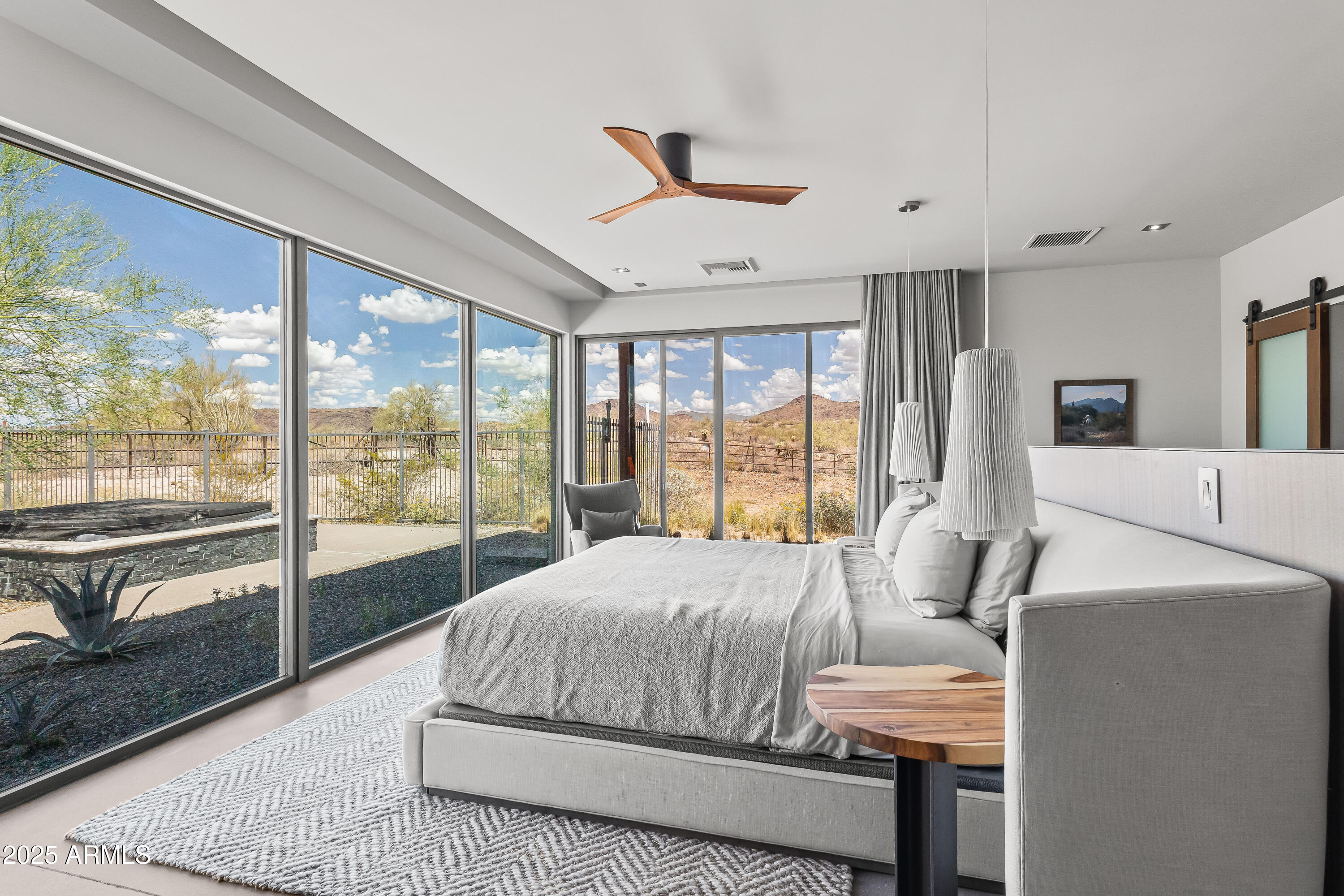 15310 North Sandy Bluff Road Fort McDowell, AZ 85264 - Photo 31 of 53 a bedroom with a large bed and a large window