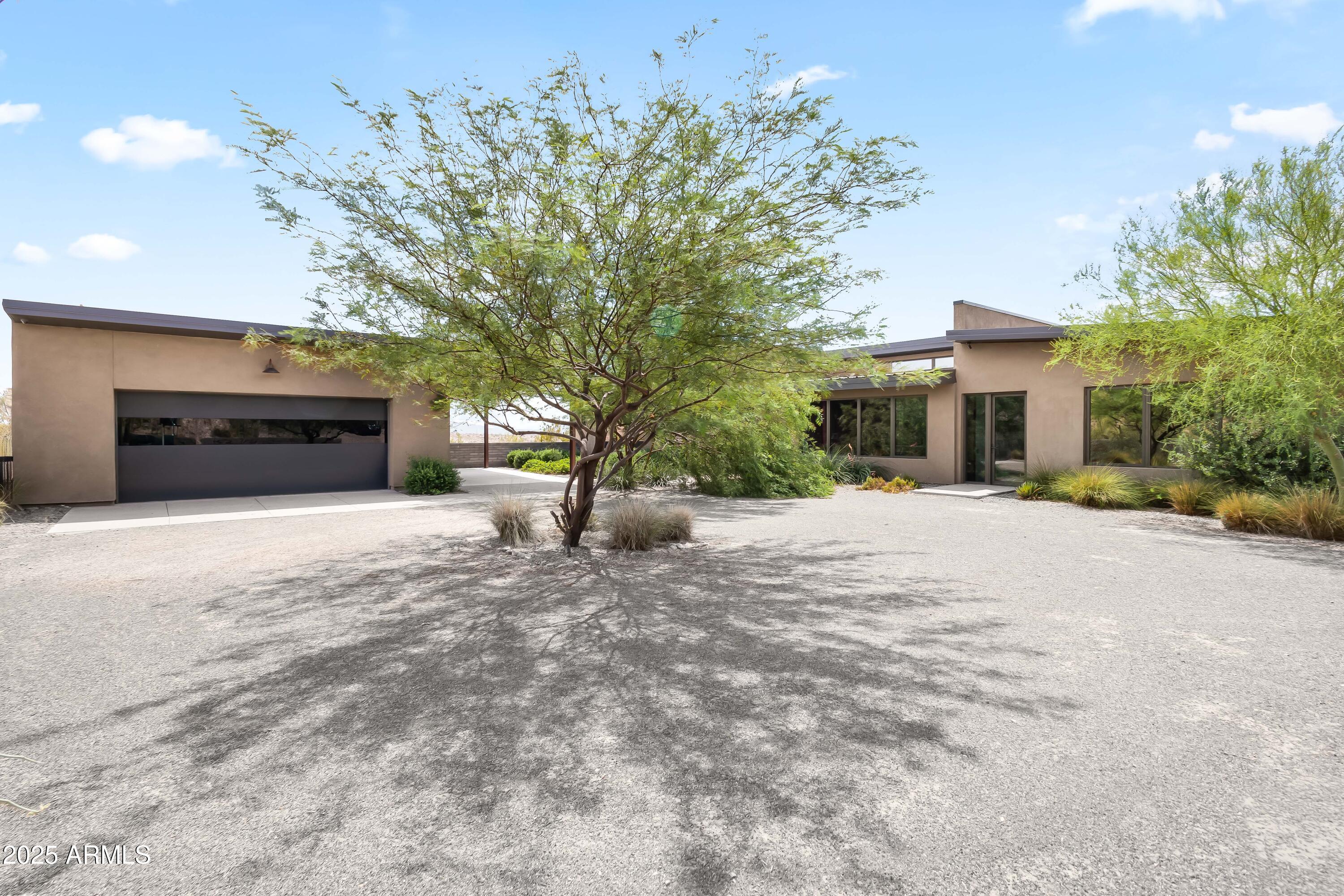 15310 North Sandy Bluff Road Fort McDowell, AZ 85264 - Photo 51 of 53 a view of a house with a yard and a large tree