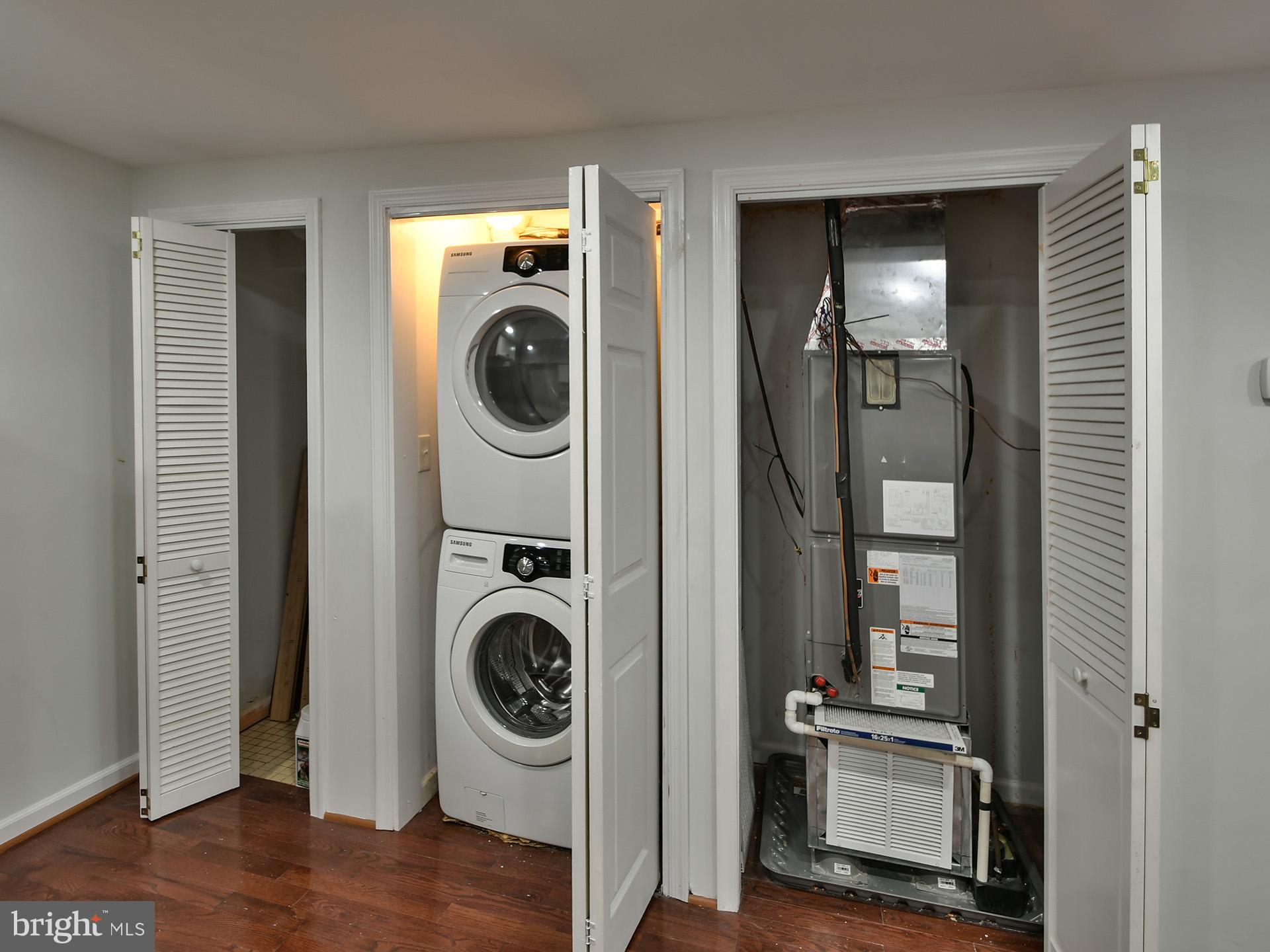 620 Irving Street Northwest, Unit 2 Washington, DC 20010 - Photo 13 of 26 a view of a hallway with washer and dryer