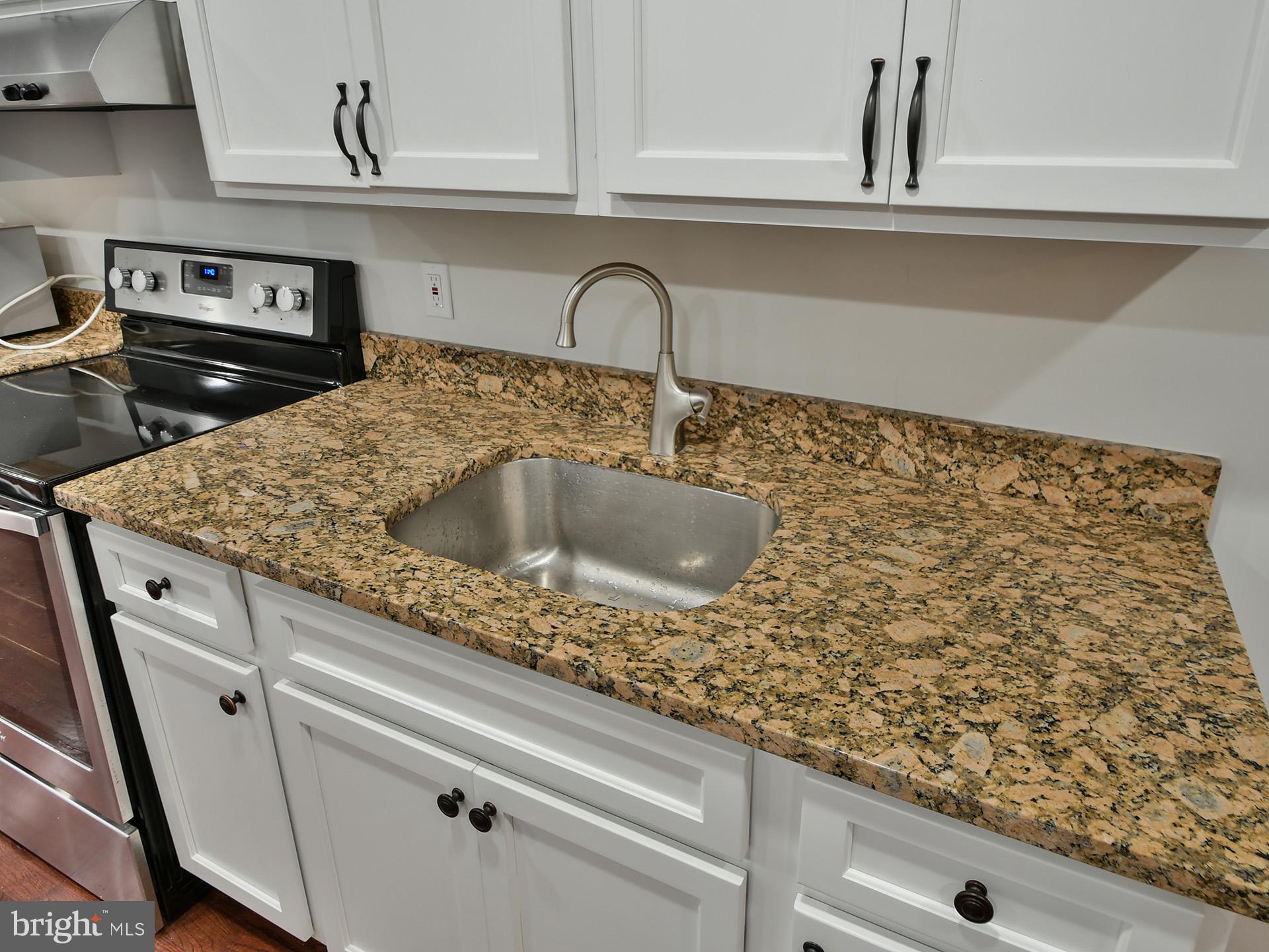 620 Irving Street Northwest, Unit 2 Washington, DC 20010 - Photo 15 of 26 a close view of sink and tap