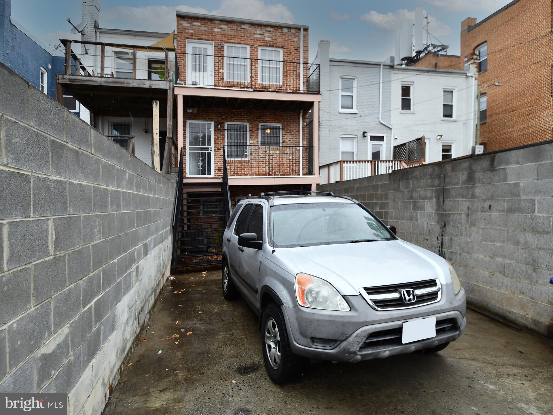 620 Irving Street Northwest, Unit 2 Washington, DC 20010 - Photo 25 of 26 a car parked in front of a building