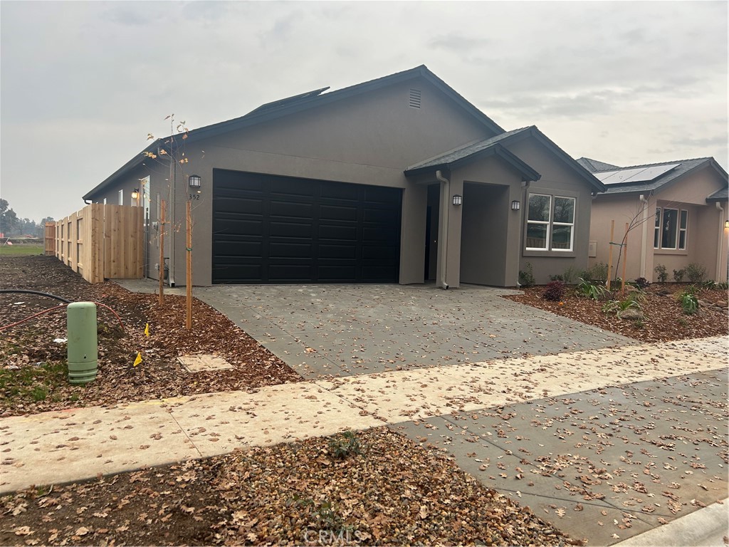 352 Gladstone Chico, CA 95973 - Photo 2 of 22 a front view of a house with a yard