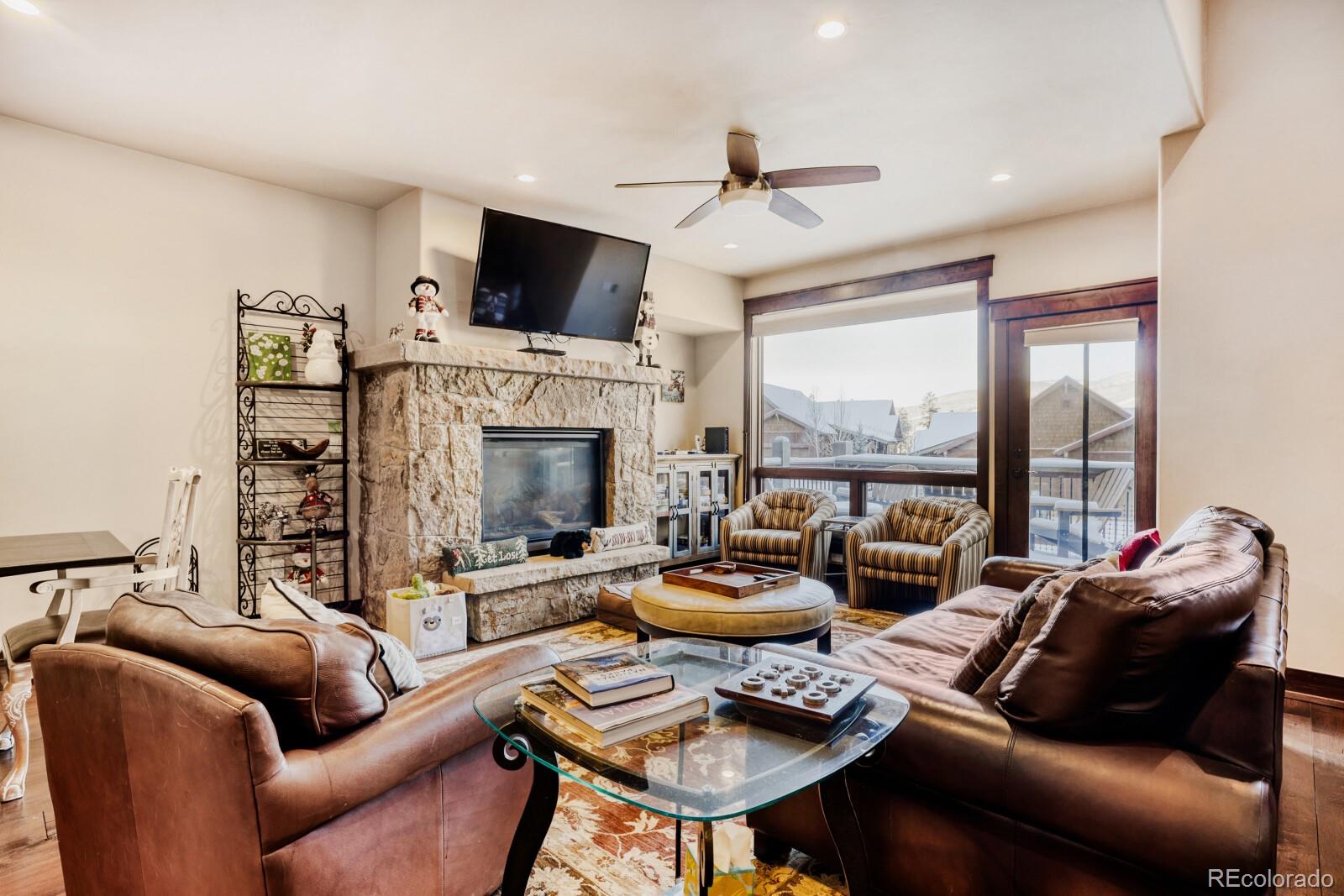 0852 Independence Road Dillon, CO 80435 - Photo 12 of 43 a living room with furniture fireplace and a large window