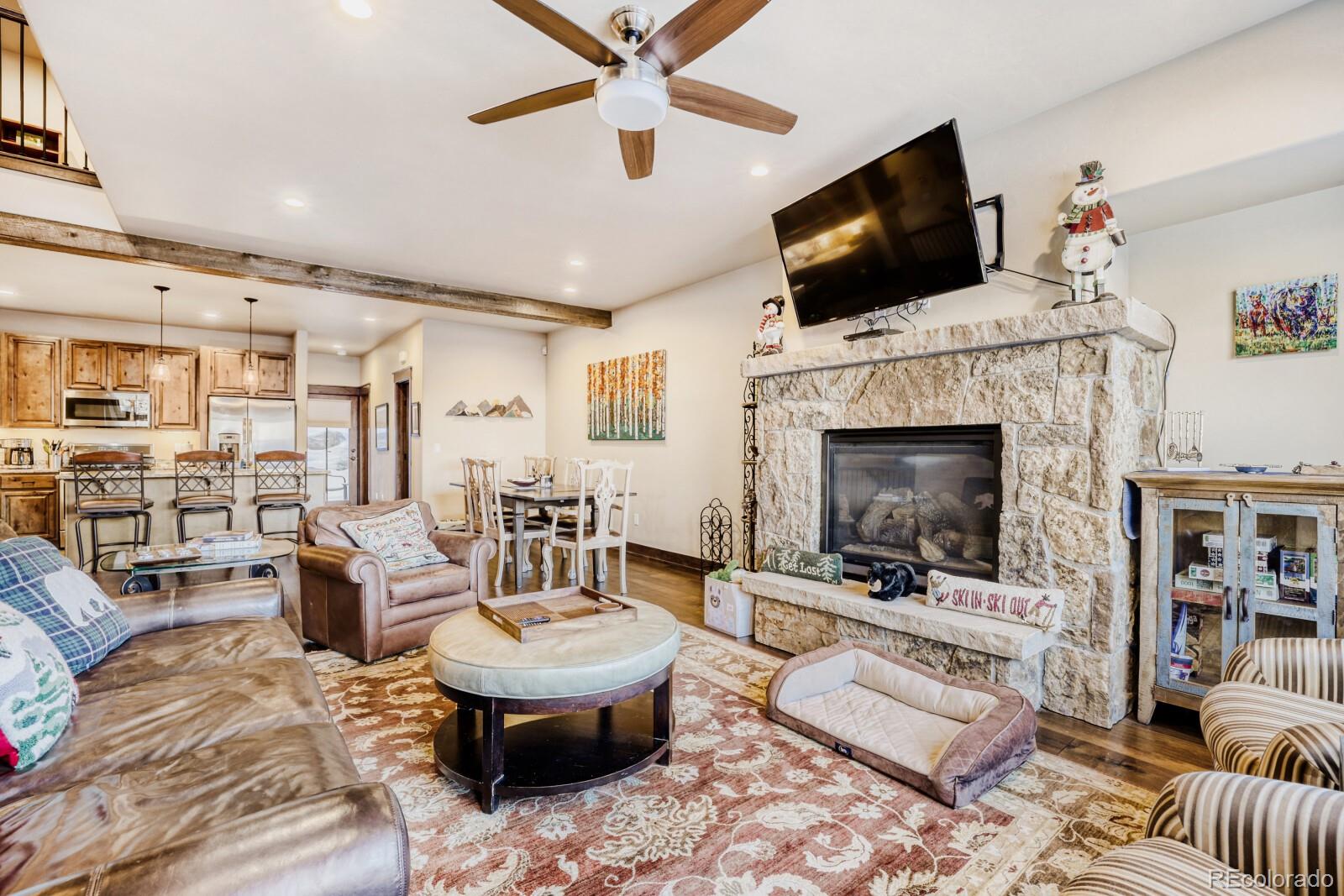 0852 Independence Road Dillon, CO 80435 - Photo 13 of 43 a living room with furniture a flat screen tv and a fireplace