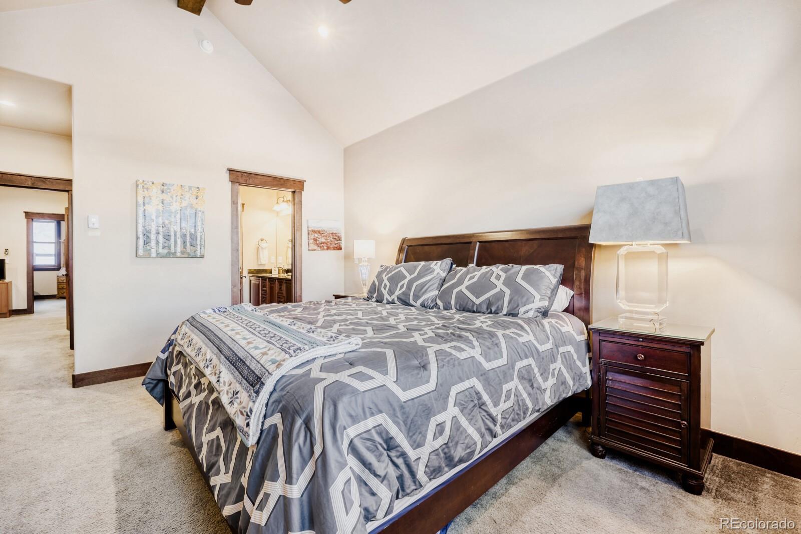 0852 Independence Road Dillon, CO 80435 - Photo 21 of 43 a bedroom with a bed and a lamp