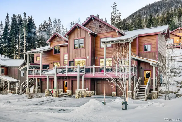 a front view of a house with a street