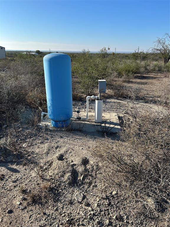 133 Brite Road Del Rio, TX 78840 - Photo 4 of 5 a view of a dry yard with wooden fence