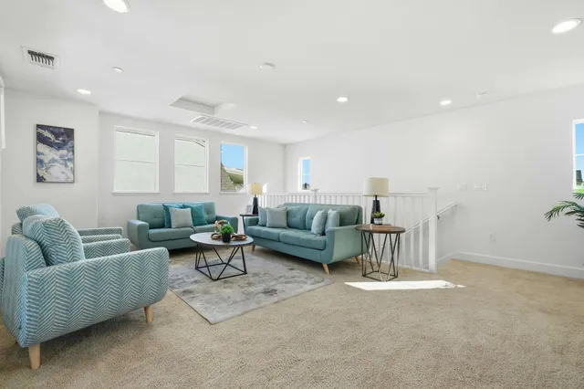 a living room with furniture and a couch