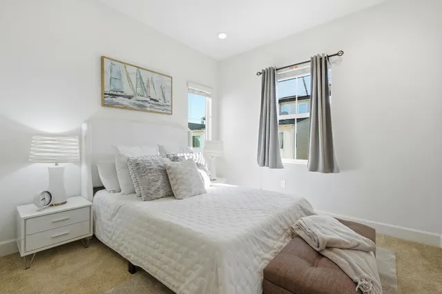 a bedroom with a bed and a couch