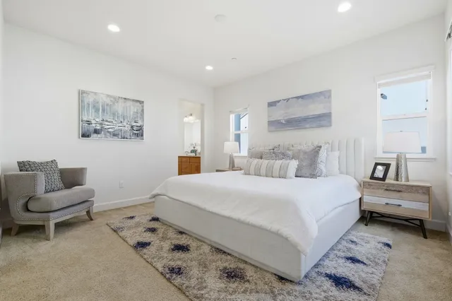 a bedroom with a bed and a couch