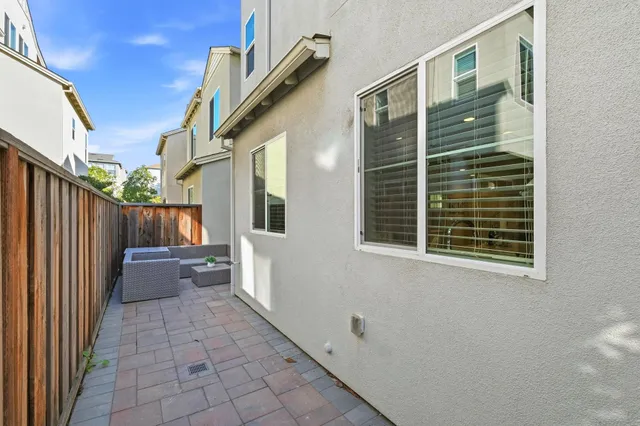 a view of a back yard from a corridor