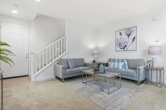 a living room with furniture and a large window