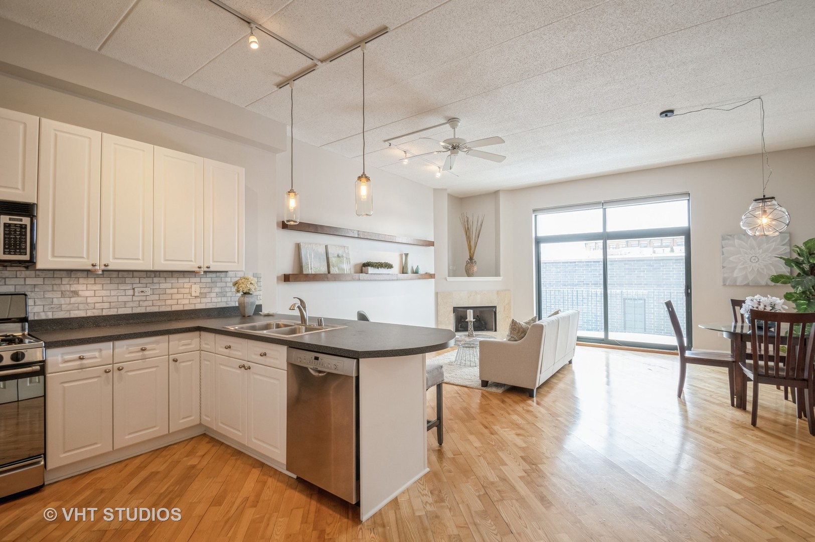 1301 West Washington Boulevard, Unit 405 Chicago, IL 60607 - Photo 5 of 10 a kitchen with stainless steel appliances granite countertop a white cabinets stove and sink