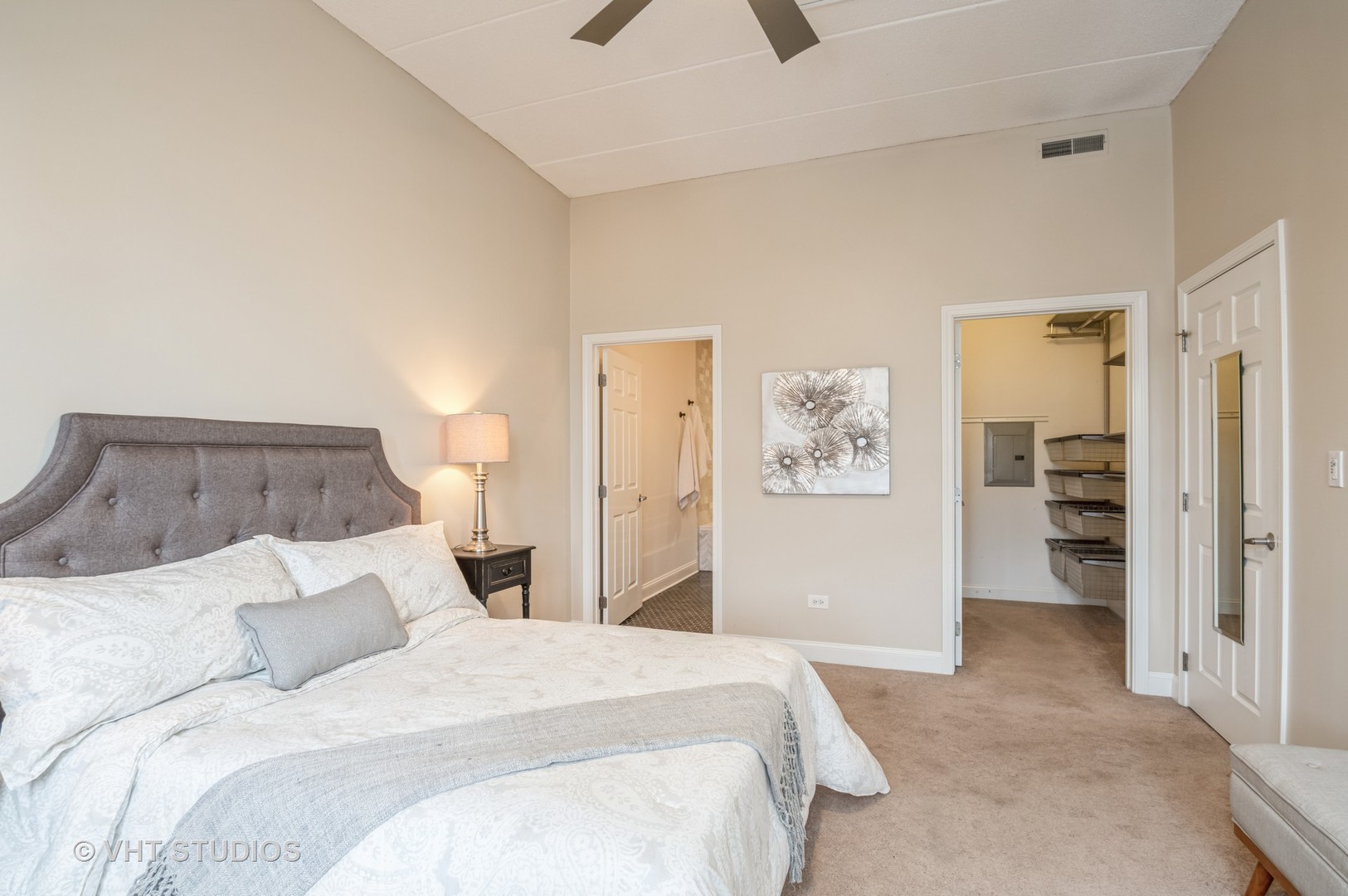 1301 West Washington Boulevard, Unit 405 Chicago, IL 60607 - Photo 8 of 10 a bedroom with a bed and painting on the wall