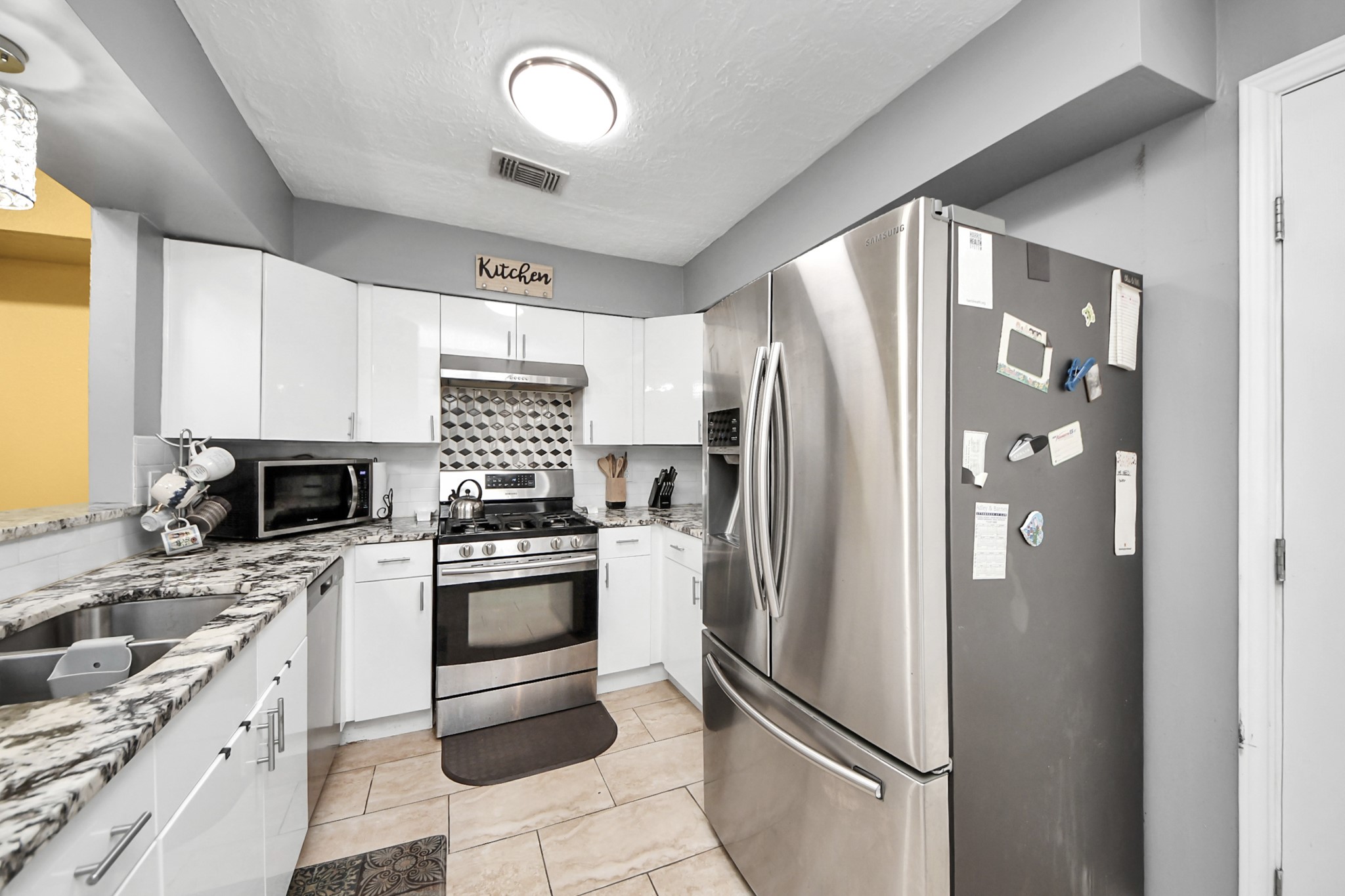 4155 Amir Street Houston, TX 77072 - Photo 21 of 43 a kitchen with stainless steel appliances granite countertop a refrigerator sink and stove