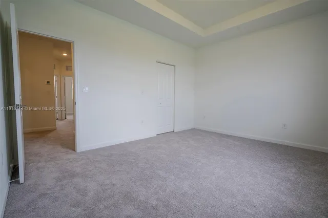 an empty room with closet area