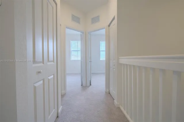 a view of a hallway with closet area