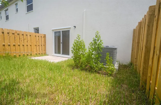 a plant is in front of a door
