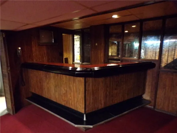 a view of a lobby area with furniture and chandelier