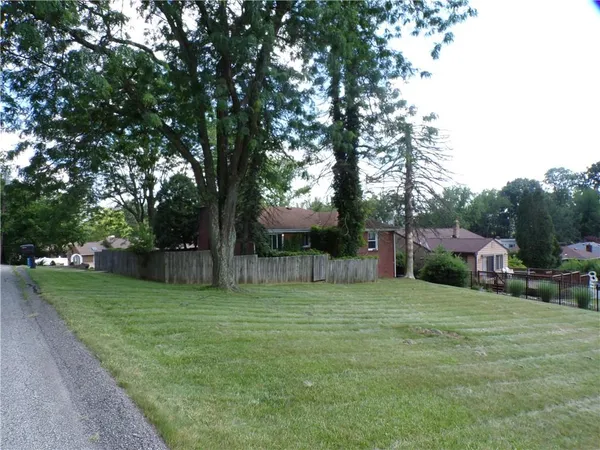 a view of a backyard with a garden
