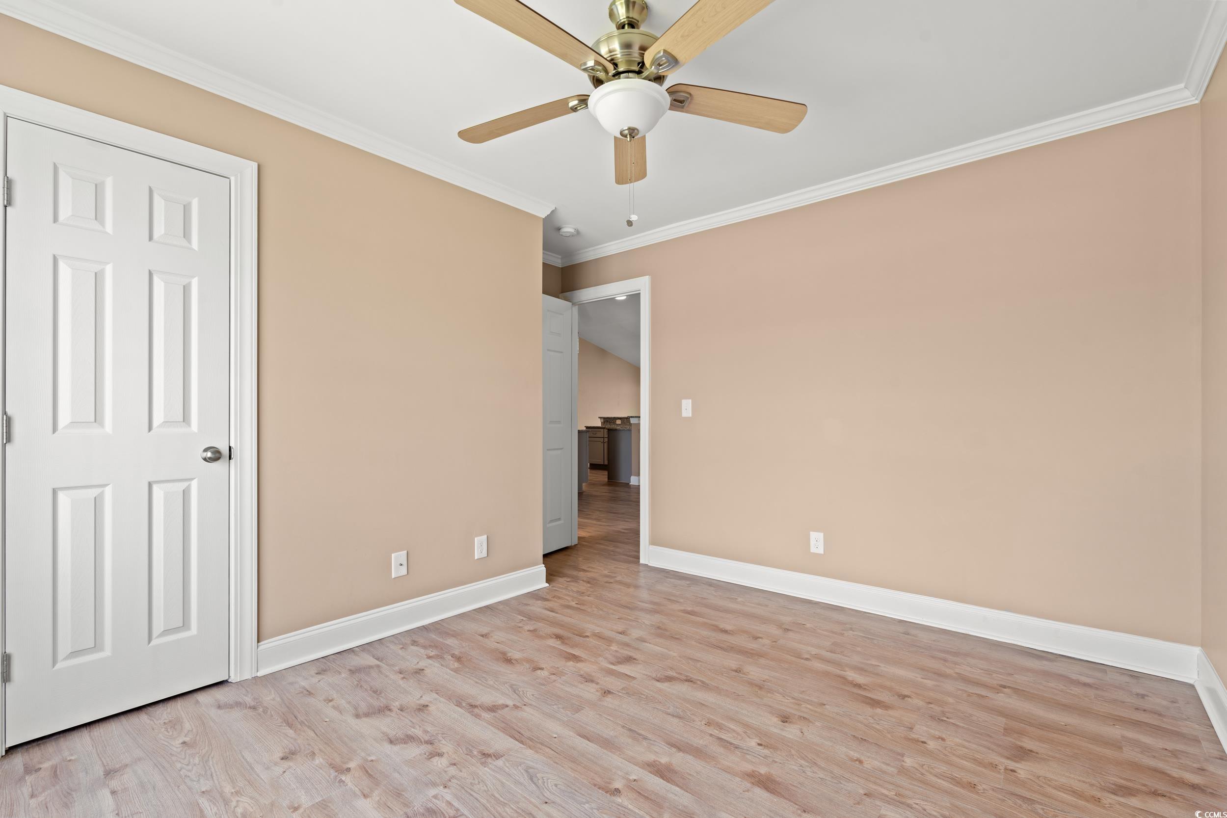 708 Alexis Drive Longs, SC 29568 - Photo 18 of 32 Unfurnished bedroom with light wood-style flooring, crown molding, and ceiling fan