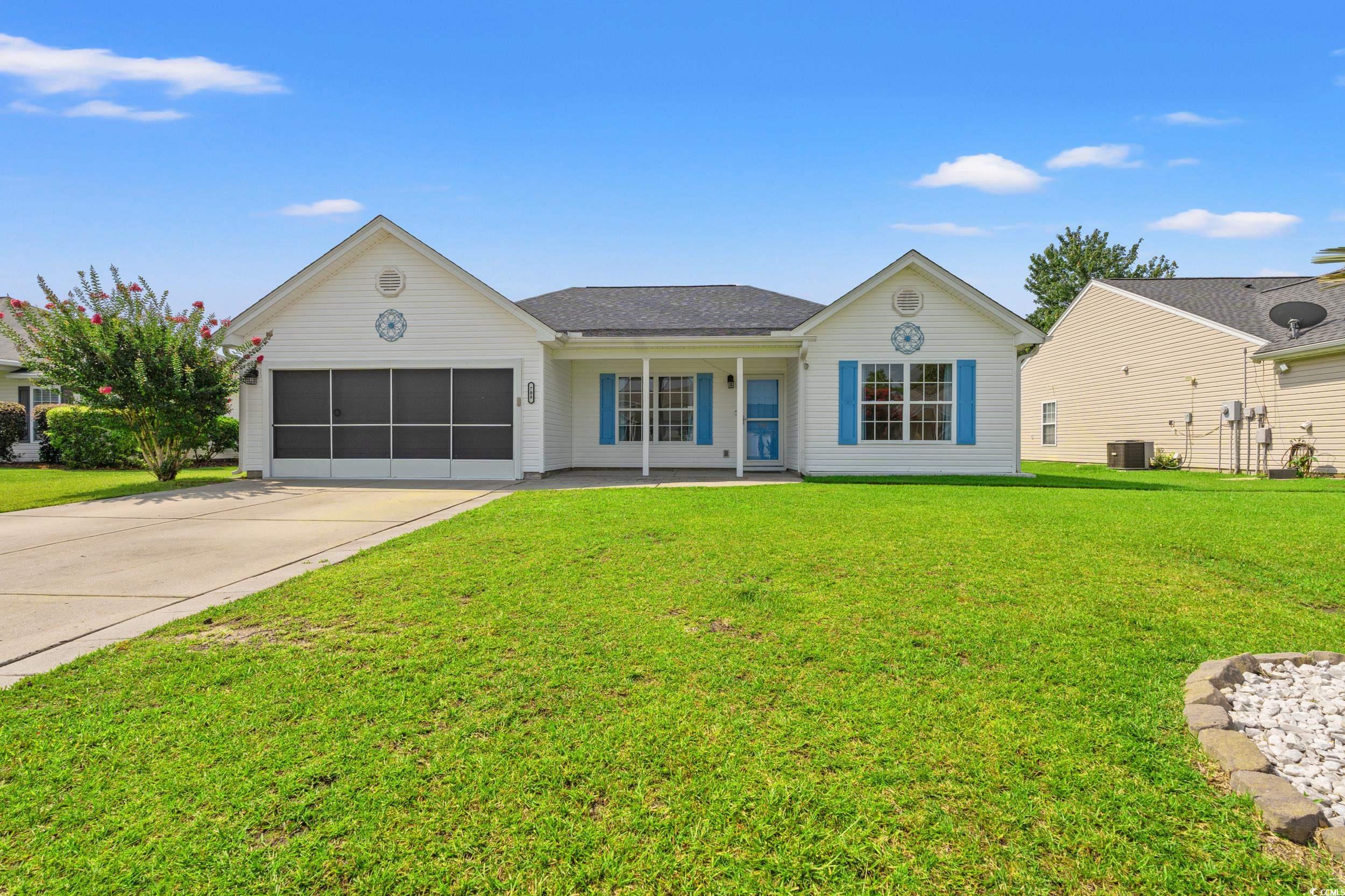 708 Alexis Drive Longs, SC 29568 - Photo 27 of 32 Ranch-style house featuring driveway, covered porch, a garage, and a front yard