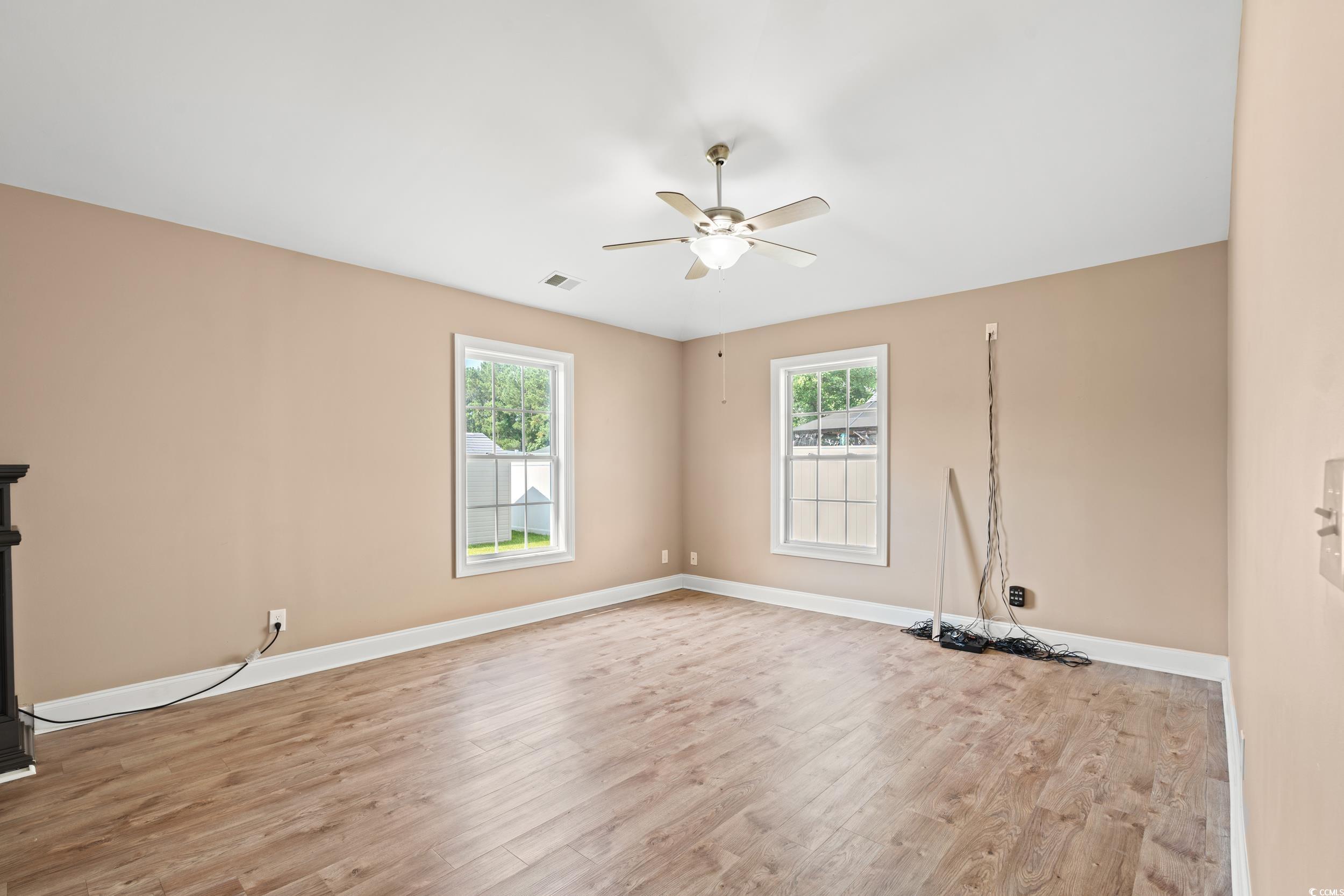 708 Alexis Drive Longs, SC 29568 - Photo 6 of 32 Spare room featuring light wood-style floors and ceiling fan