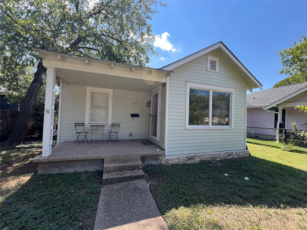 View of front of property with covered porch