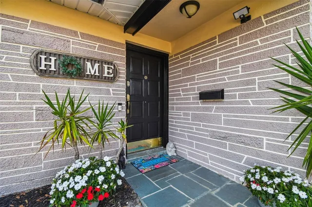 a front view of a house with swimming pool