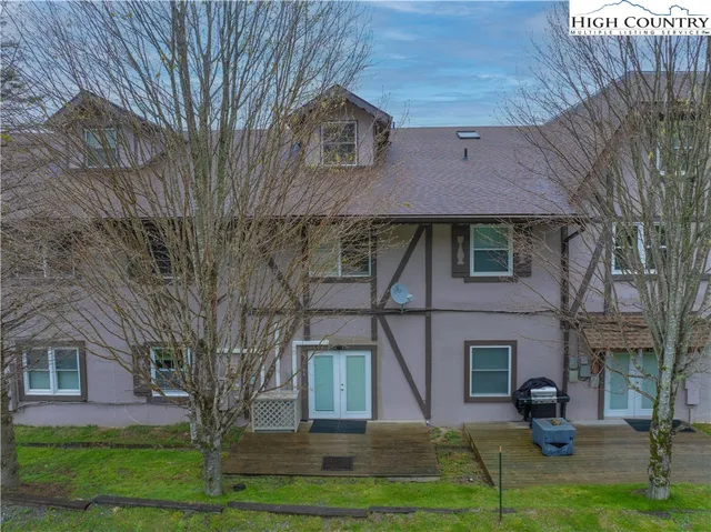 a view of a building with a yard