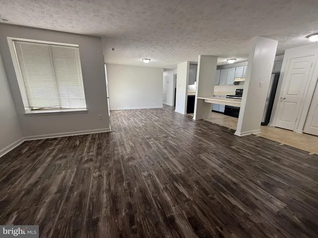 a view of kitchen and wooden floor