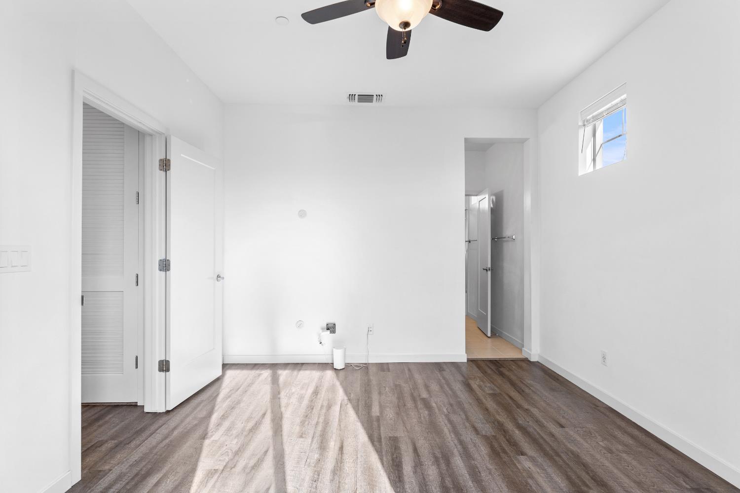 2643 Cleat Lane, Unit 34B Sacramento, CA 95818 - Photo 13 of 39 wooden floor in an empty room