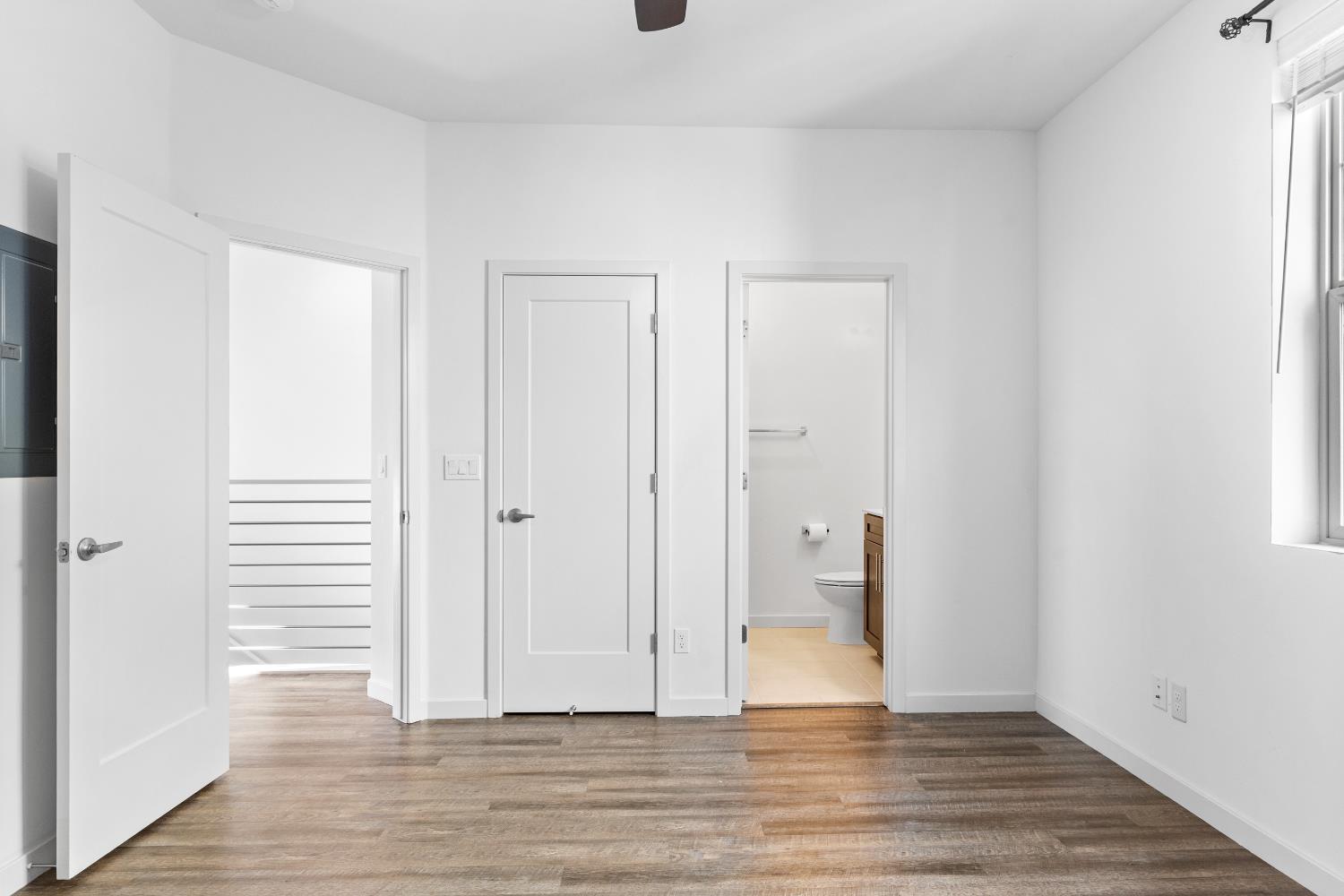 2643 Cleat Lane, Unit 34B Sacramento, CA 95818 - Photo 18 of 39 a view of an empty room and wooden floor