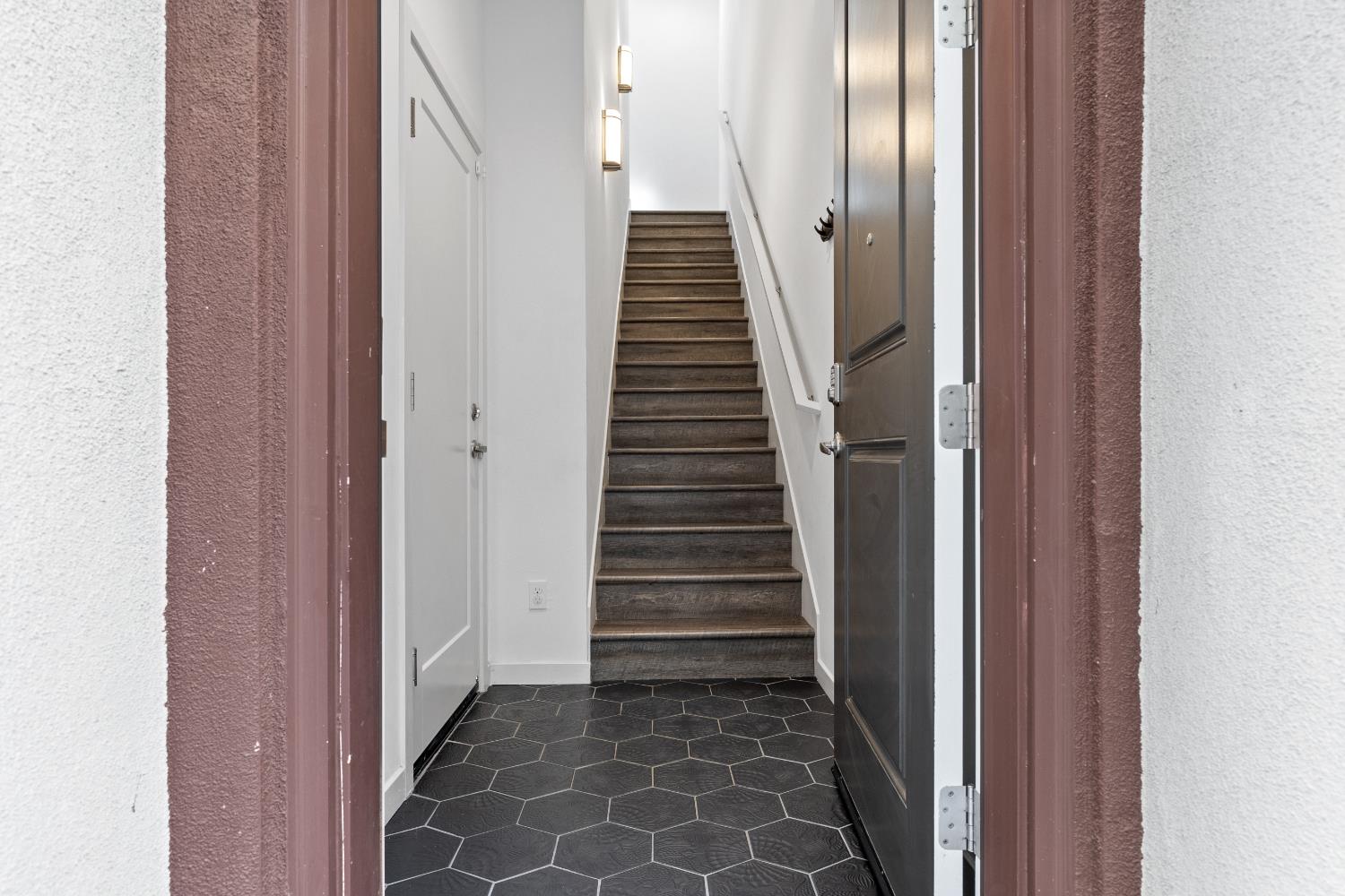2643 Cleat Lane, Unit 34B Sacramento, CA 95818 - Photo 24 of 39 a view of a hallway with stairs