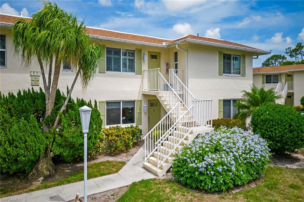 448 Teryl Road, Unit 2341 Naples, FL 34112 - Photo 1 of 32 a front view of a house with garden