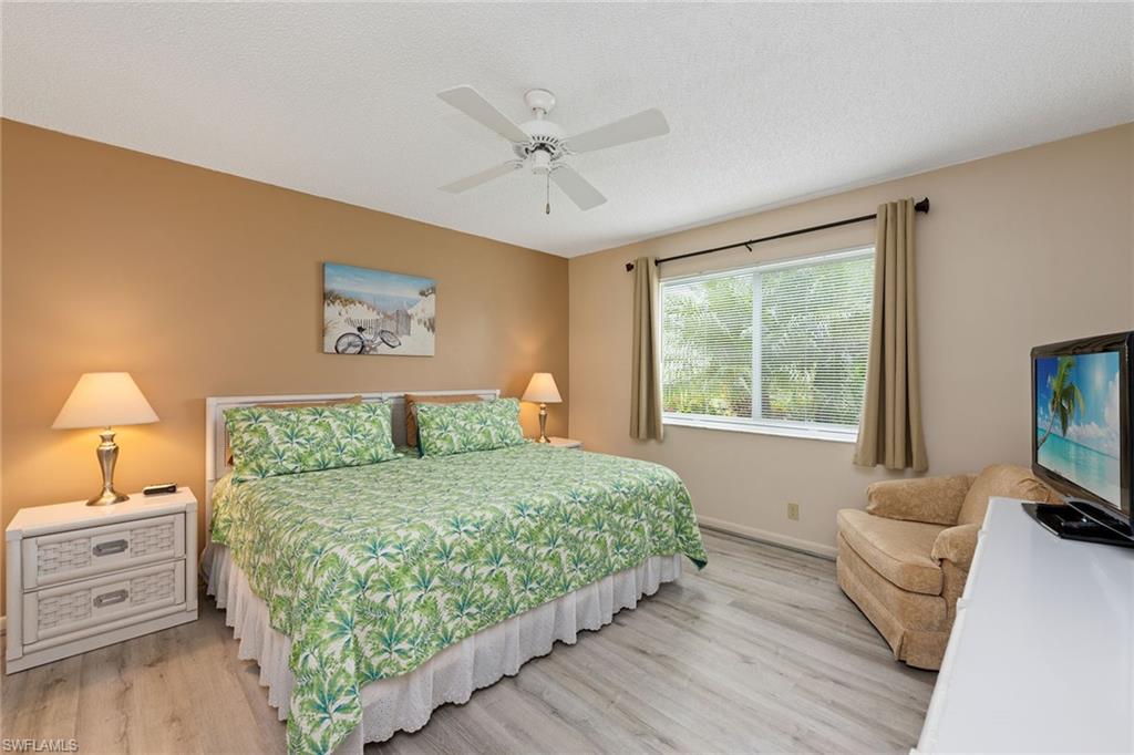 448 Teryl Road, Unit 2341 Naples, FL 34112 - Photo 13 of 32 a bedroom with a bed and a window