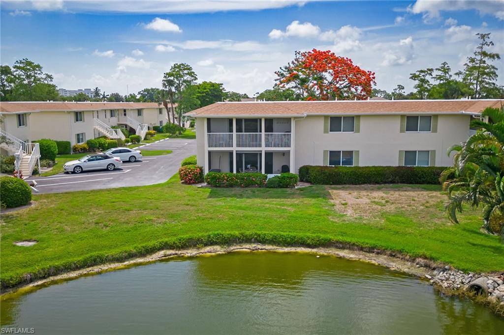448 Teryl Road, Unit 2341 Naples, FL 34112 - Photo 21 of 32 a view of a house with a yard patio and swimming pool
