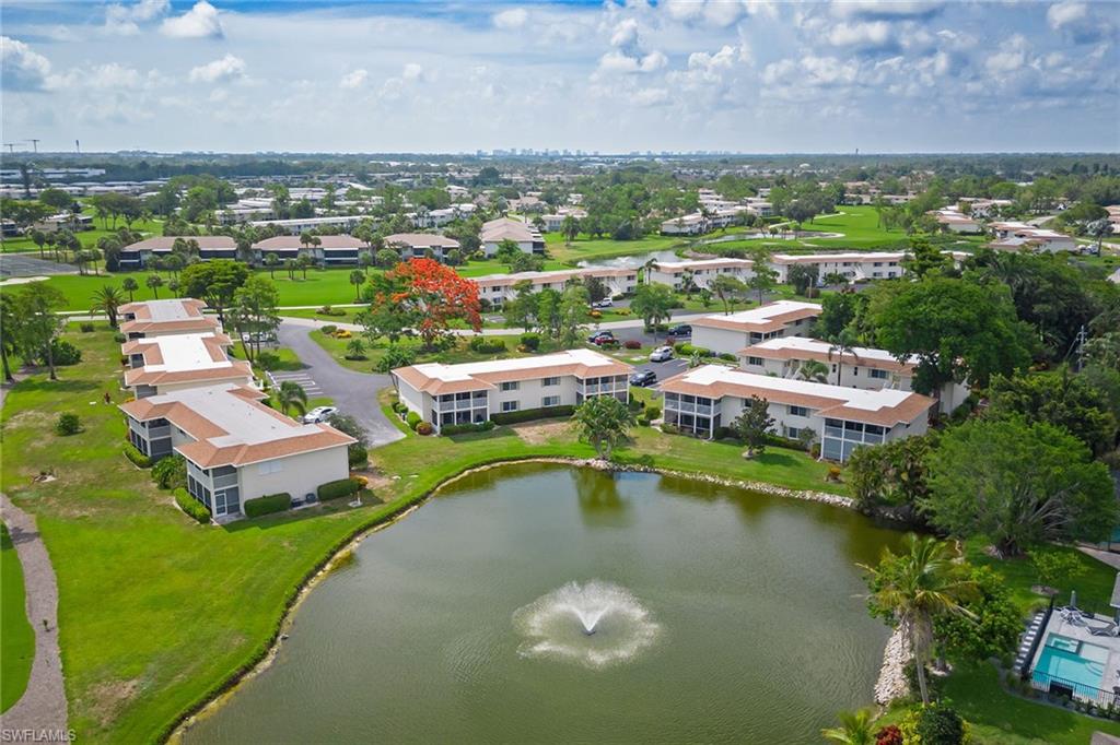 448 Teryl Road, Unit 2341 Naples, FL 34112 - Photo 22 of 32 a view of a lake with a city