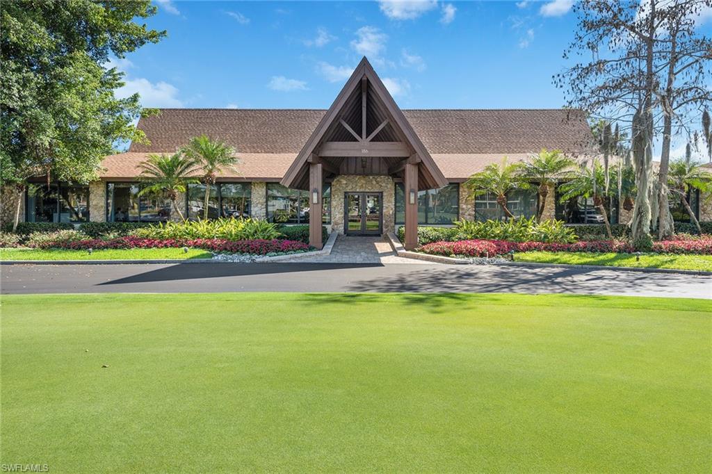 448 Teryl Road, Unit 2341 Naples, FL 34112 - Photo 26 of 32 a front view of building with an outdoor space and seating