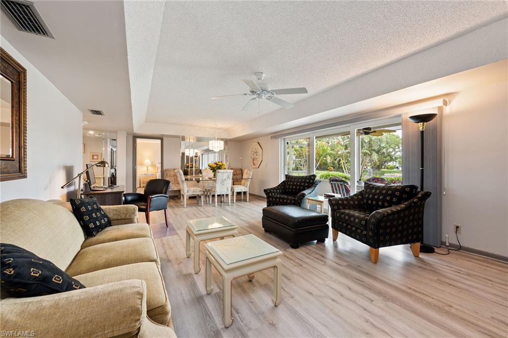 448 Teryl Road, Unit 2341 Naples, FL 34112 - Photo 4 of 32 a living room with furniture and a large window