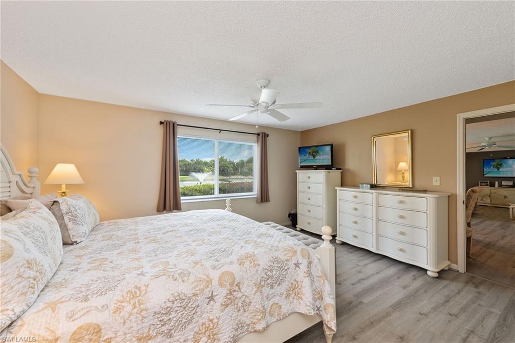 448 Teryl Road, Unit 2341 Naples, FL 34112 - Photo 10 of 32 a bedroom with a bed and a window