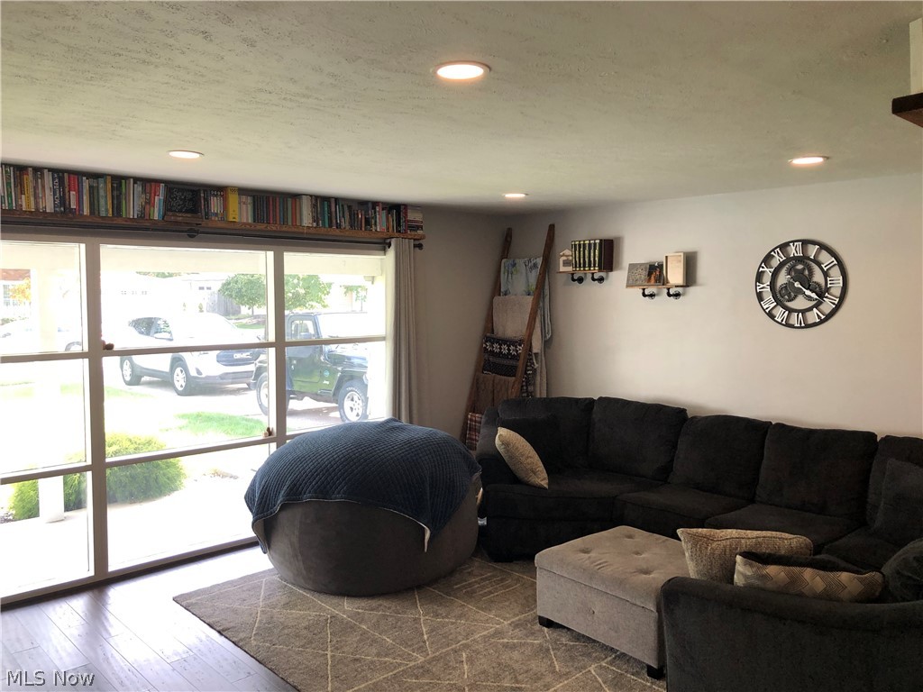 6374 Sherborn Road Parma Heights, OH 44130 - Photo 6 of 19 The living room boasts an engineered wood floor, and a large picture window!