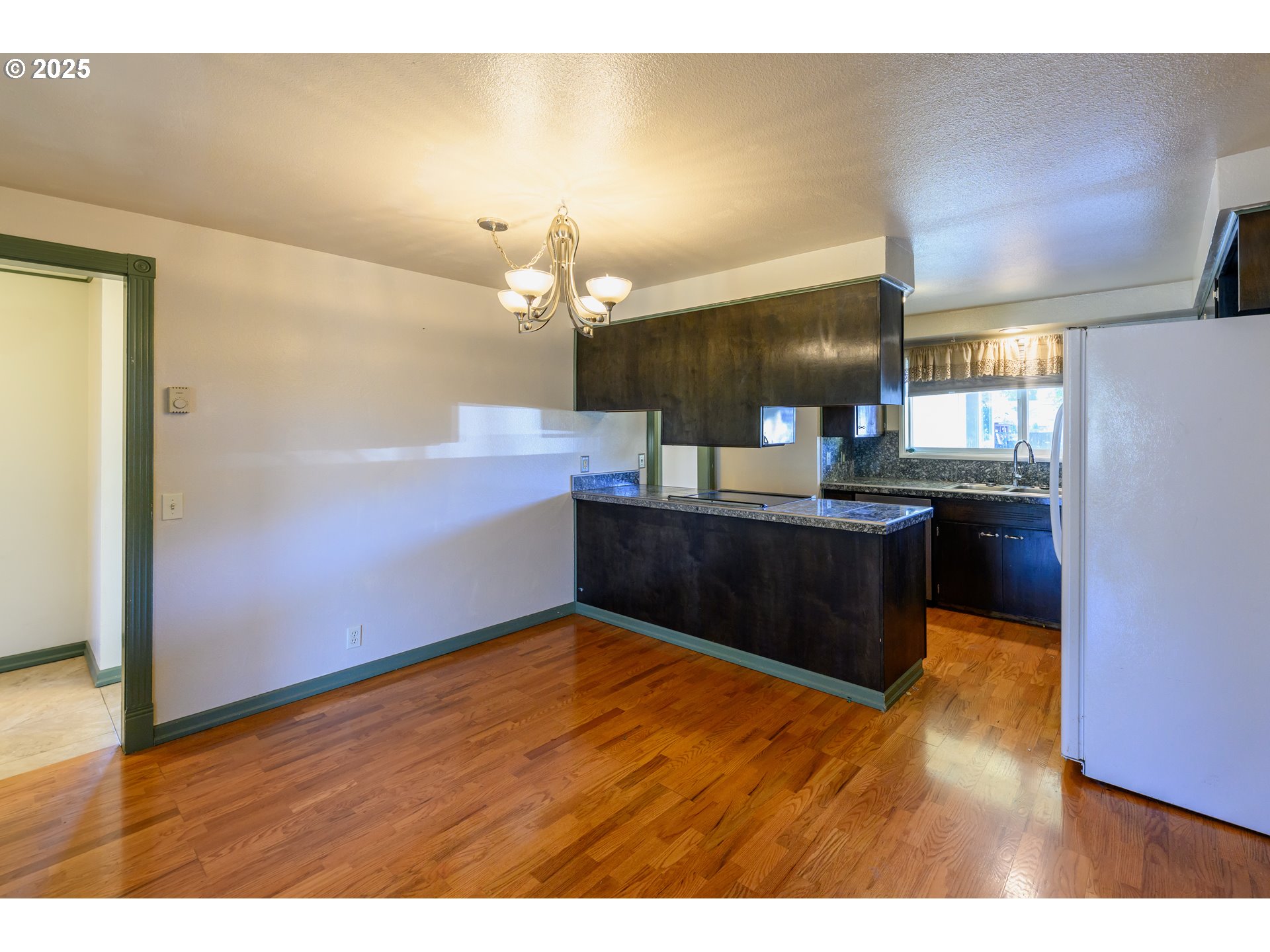 3854 Jasper Road Springfield, OR 97478 - Photo 11 of 33 a kitchen with granite countertop a sink counter top space and cabinets