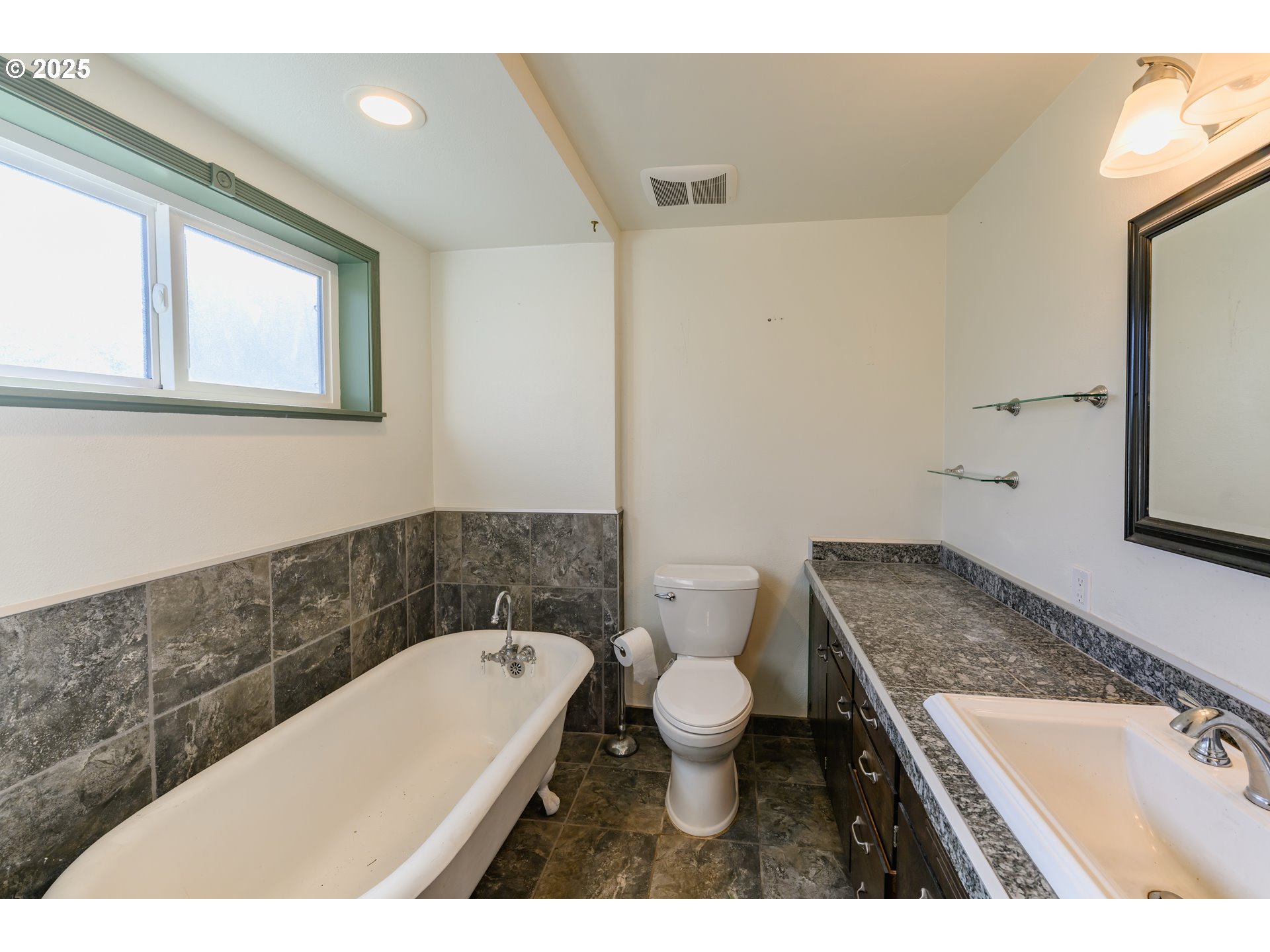3854 Jasper Road Springfield, OR 97478 - Photo 20 of 33 a bathroom with a granite countertop sink a toilet and mirror