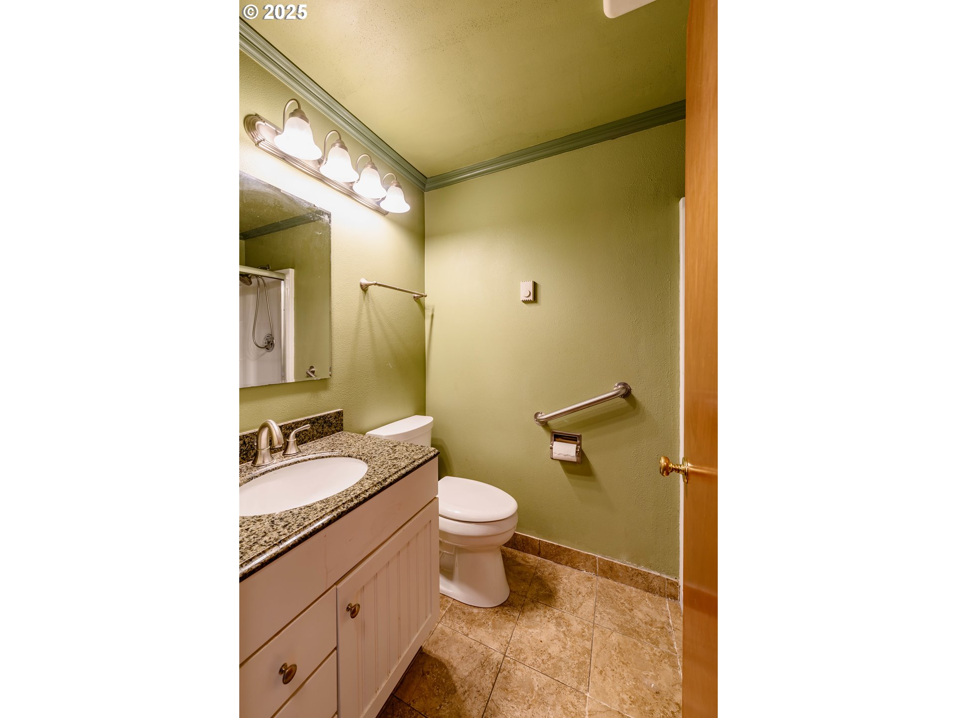 3854 Jasper Road Springfield, OR 97478 - Photo 23 of 33 a bathroom with a granite countertop sink toilet and mirror