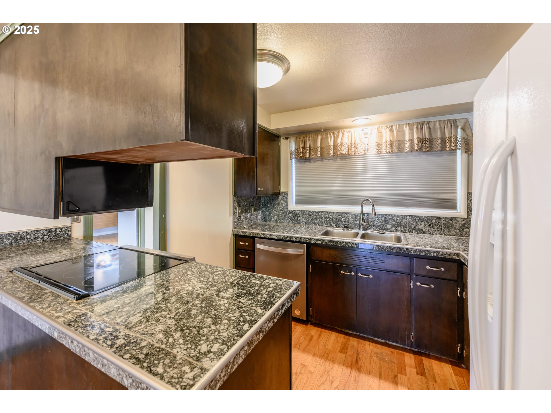 3854 Jasper Road Springfield, OR 97478 - Photo 9 of 33 a kitchen with kitchen island granite countertop a stove and a sink