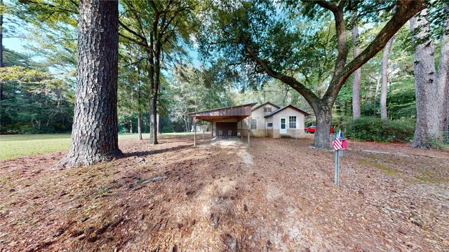 a kitchen that has a sink a stove and a refrigerator